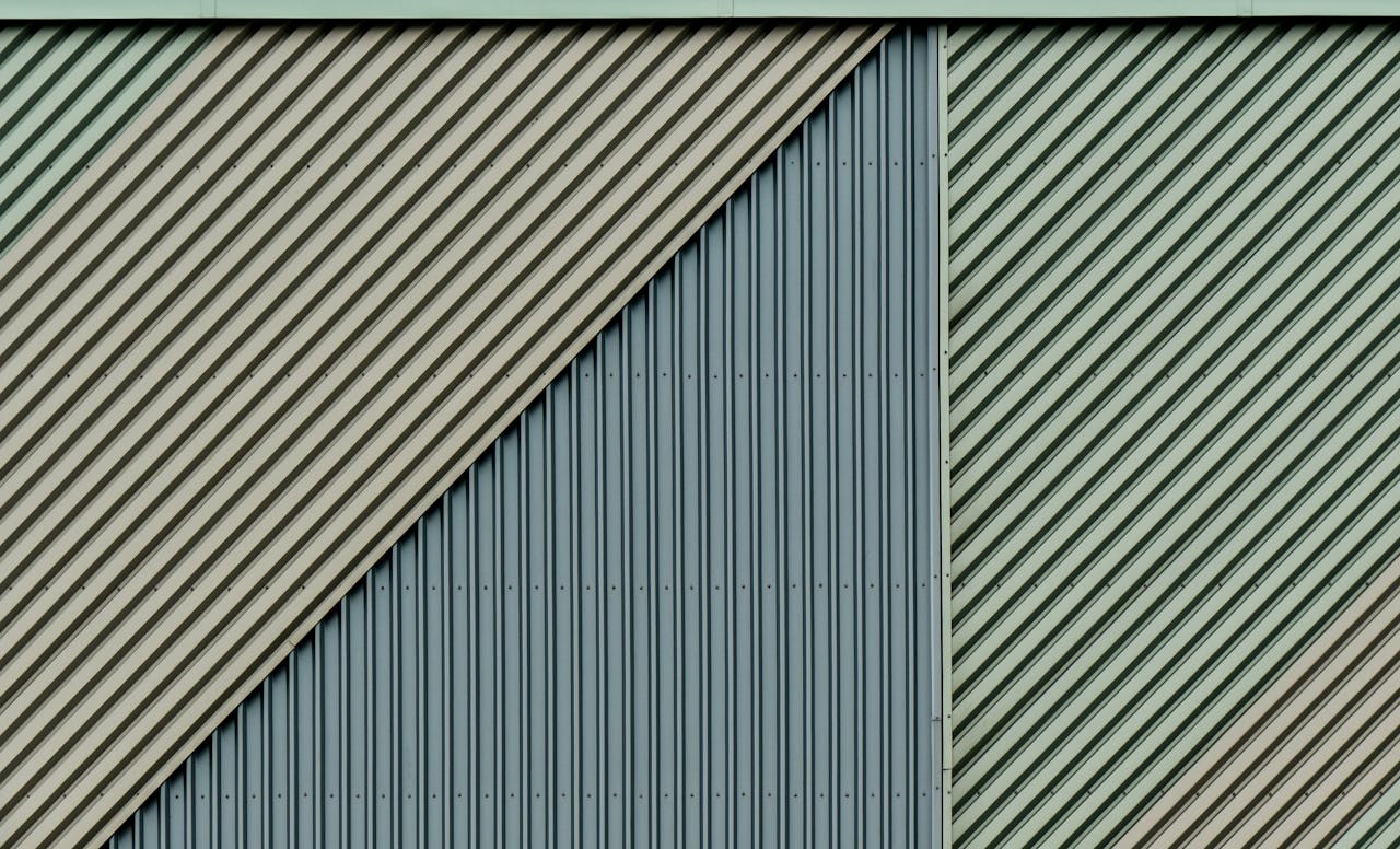 Close-up of a diagonal patterned metal wall with a unique texture design.